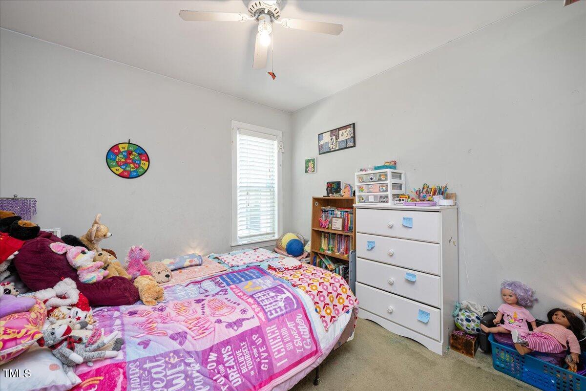 604 Sinewell Drive Wake Forest, NC 27587 - Photo 16 of 25 a bedroom with a bed and a window