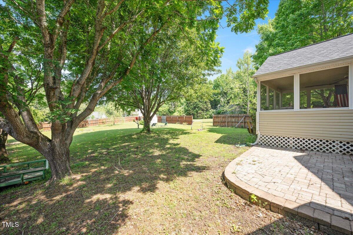 604 Sinewell Drive Wake Forest, NC 27587 - Photo 19 of 25 a view of a backyard with a garden