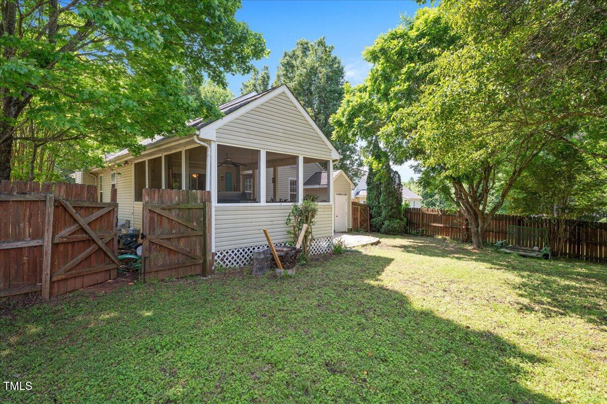 604 Sinewell Drive Wake Forest, NC 27587 - Photo 22 of 25 a view of a small house with a yard
