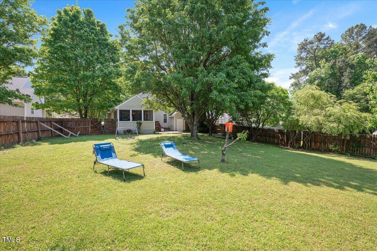 604 Sinewell Drive Wake Forest, NC 27587 - Photo 23 of 25 a view of a house with backyard porch and sitting area