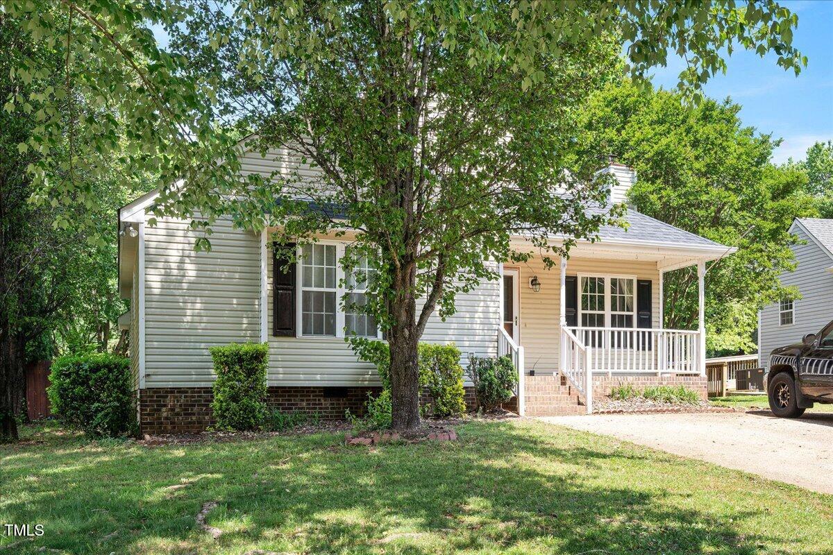604 Sinewell Drive Wake Forest, NC 27587 - Photo 3 of 25 a front view of a house with a garden and yard
