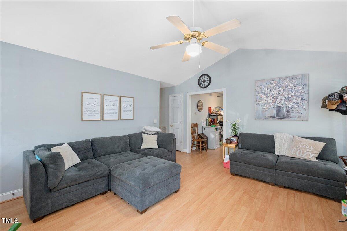 604 Sinewell Drive Wake Forest, NC 27587 - Photo 5 of 25 a living room with furniture and a flat screen tv