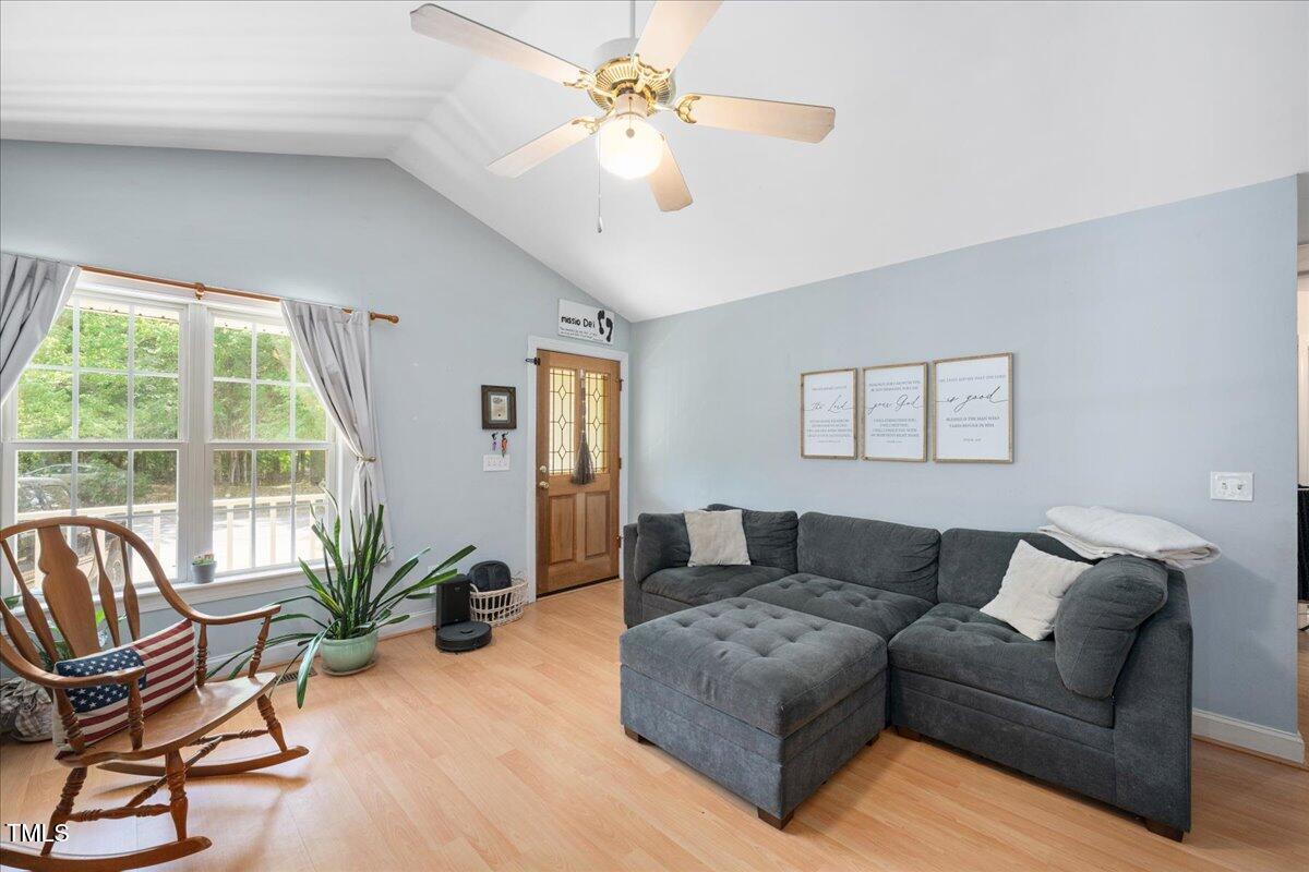 604 Sinewell Drive Wake Forest, NC 27587 - Photo 6 of 25 a living room with furniture and a large window