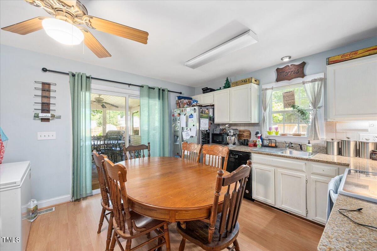 604 Sinewell Drive Wake Forest, NC 27587 - Photo 8 of 25 a view of a dining room with furniture and a window