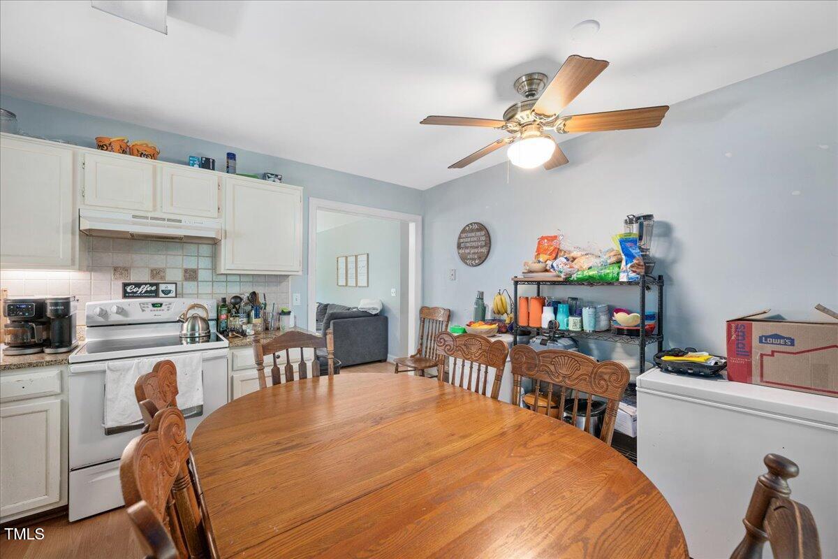 604 Sinewell Drive Wake Forest, NC 27587 - Photo 10 of 25 a bed room with a bed a desk and chair with white walls