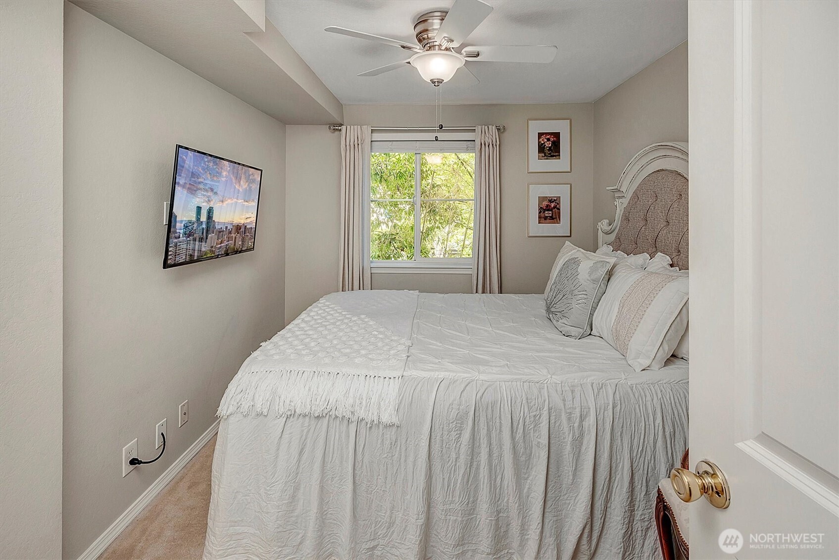 300 10th Avenue, Unit B205 Seattle, WA 98122 - Photo 13 of 27 a bedroom with a bed and a window