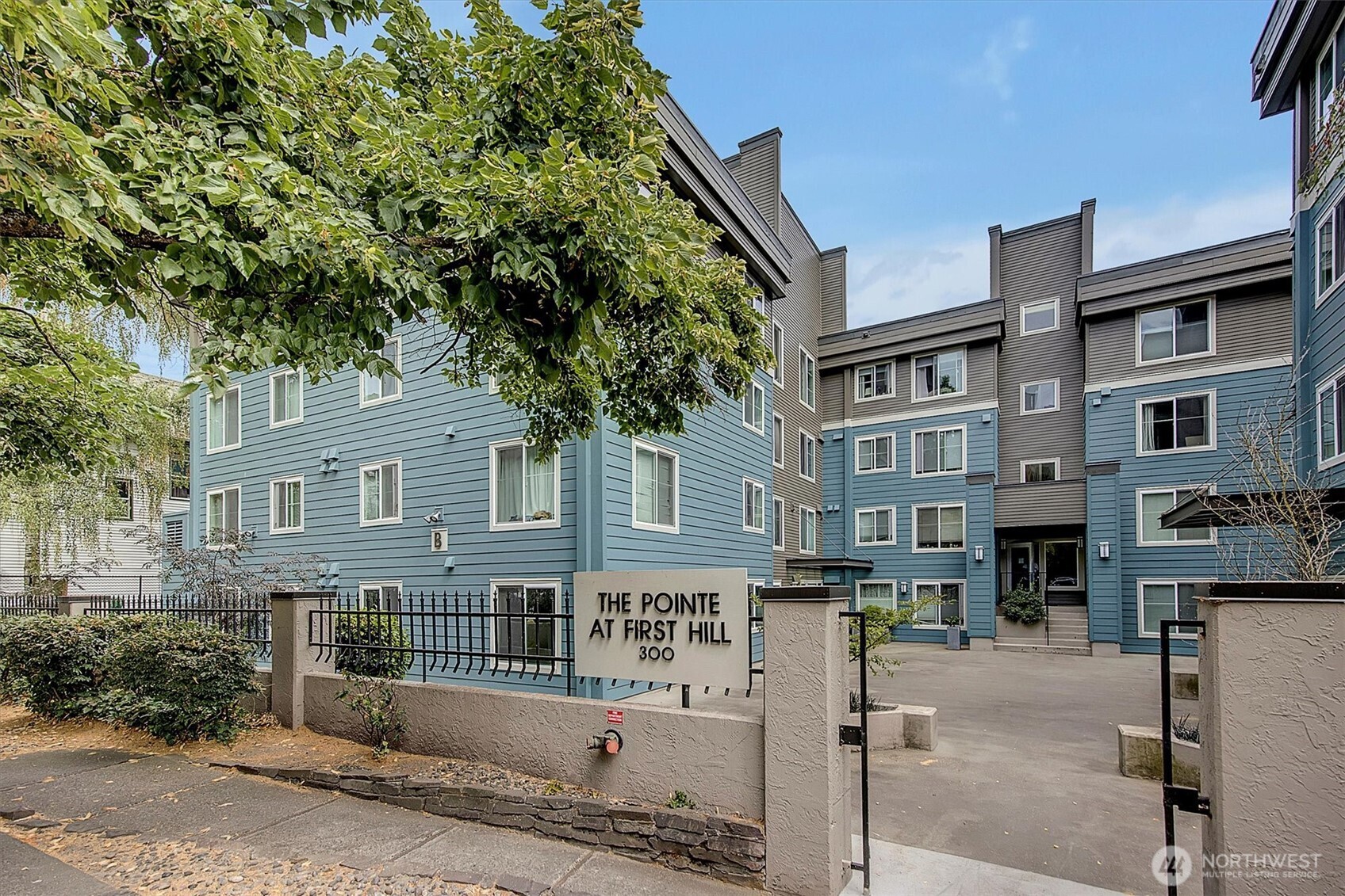 300 10th Avenue, Unit B205 Seattle, WA 98122 - Photo 23 of 27 a front view of a building with street view