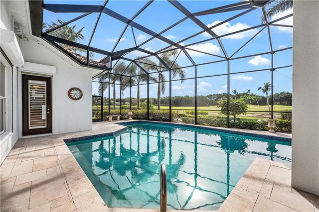 a front view of a house with a swimming pool