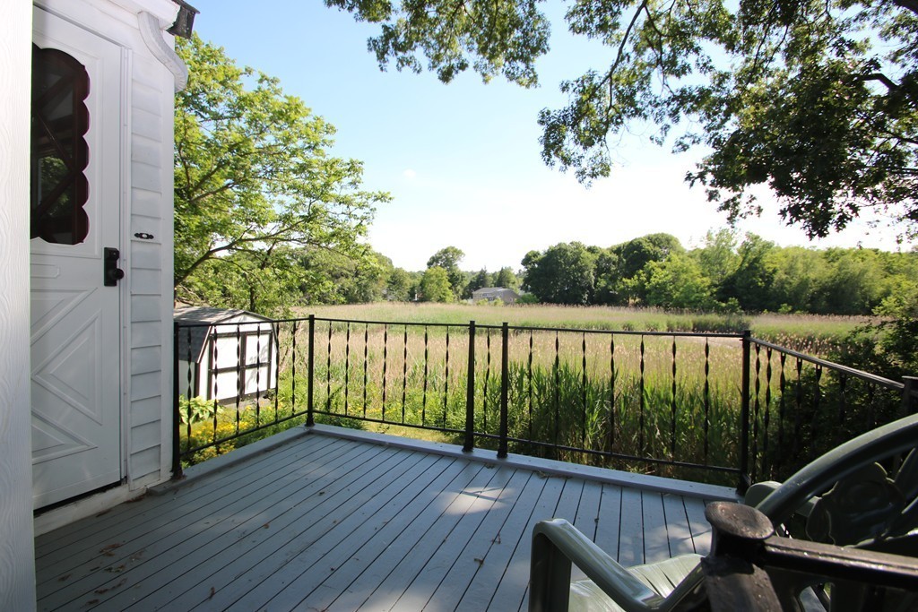 85 Riverbank Road Saugus, MA 01906 - Photo 15 of 20 a view of balcony with wooden floor and fence
