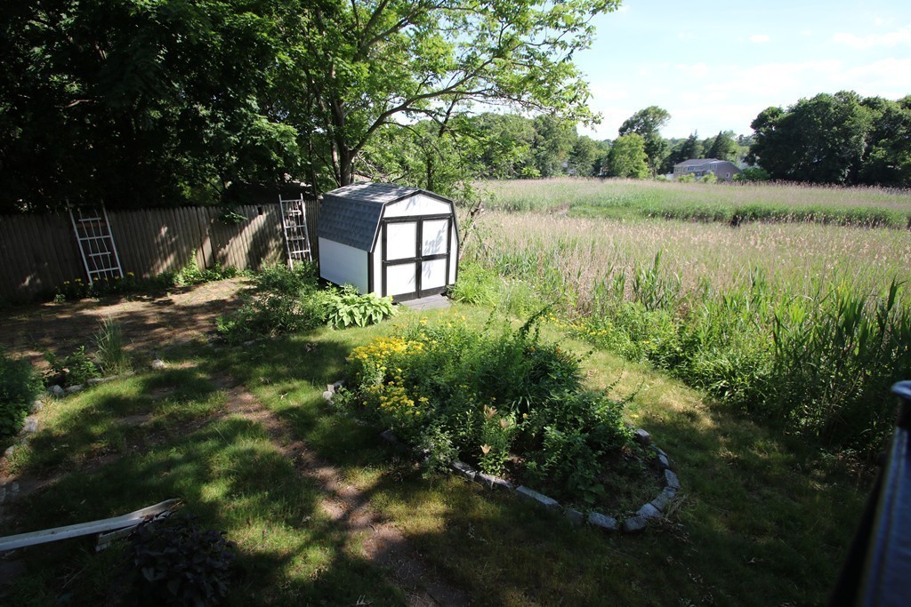 85 Riverbank Road Saugus, MA 01906 - Photo 17 of 20 a view of a garden with a lake