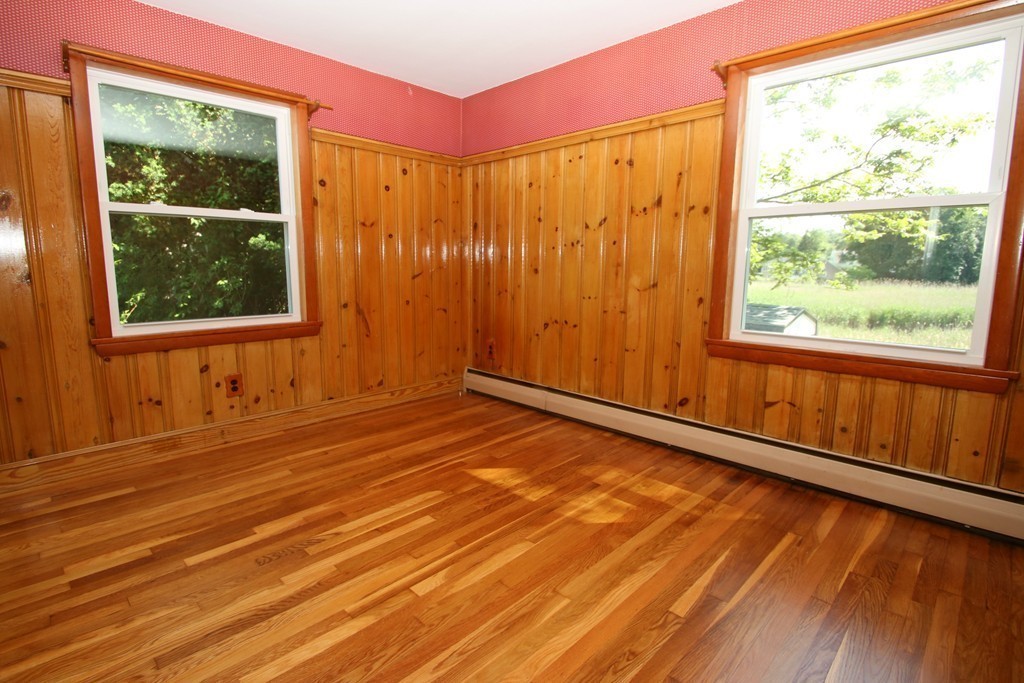 85 Riverbank Road Saugus, MA 01906 - Photo 8 of 20 a view of a room with wooden floor and a window