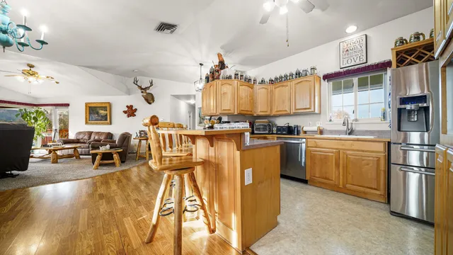 a kitchen with lots of counter top space and appliances