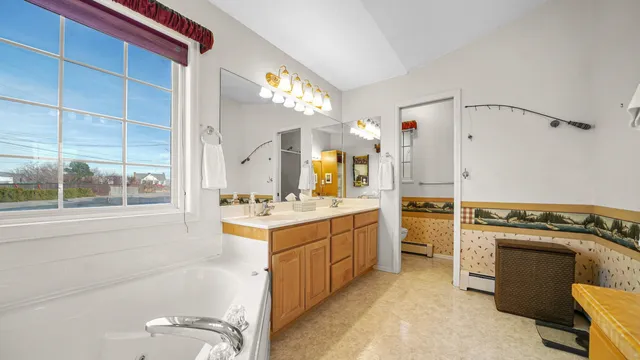 a kitchen with a stove a sink and a refrigerator