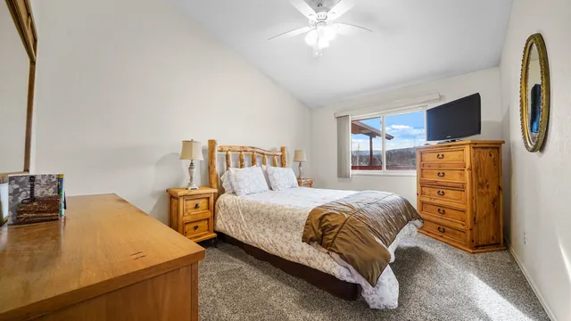 a bedroom with a bed and dresser