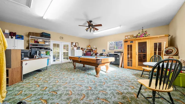 a living room with furniture a rug and a flat screen tv