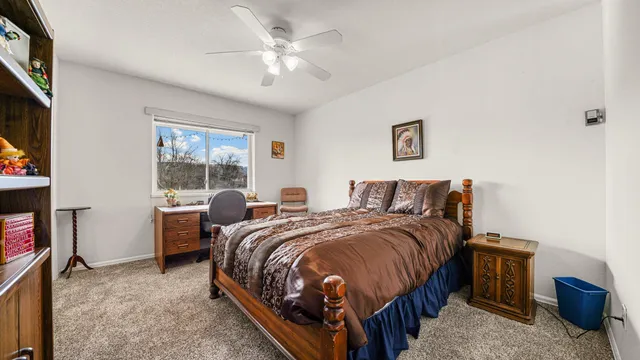 a bed room with a bed and a window