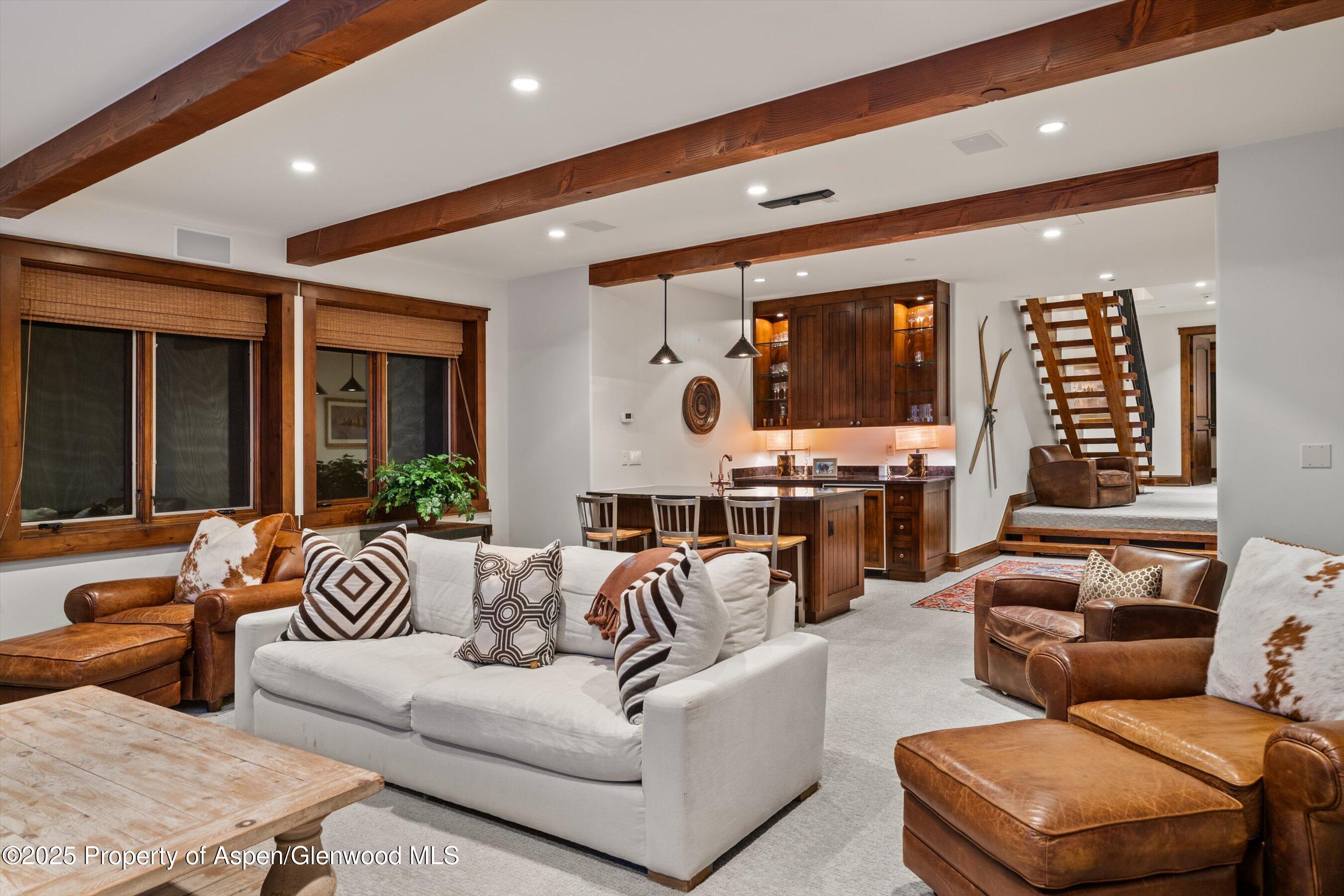 1430 Sierra Vista Drive Aspen, CO 81611 - Photo 13 of 57 a living room with furniture kitchen view and large windows