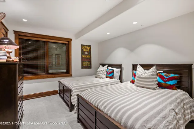 a bedroom with a bed and a fireplace