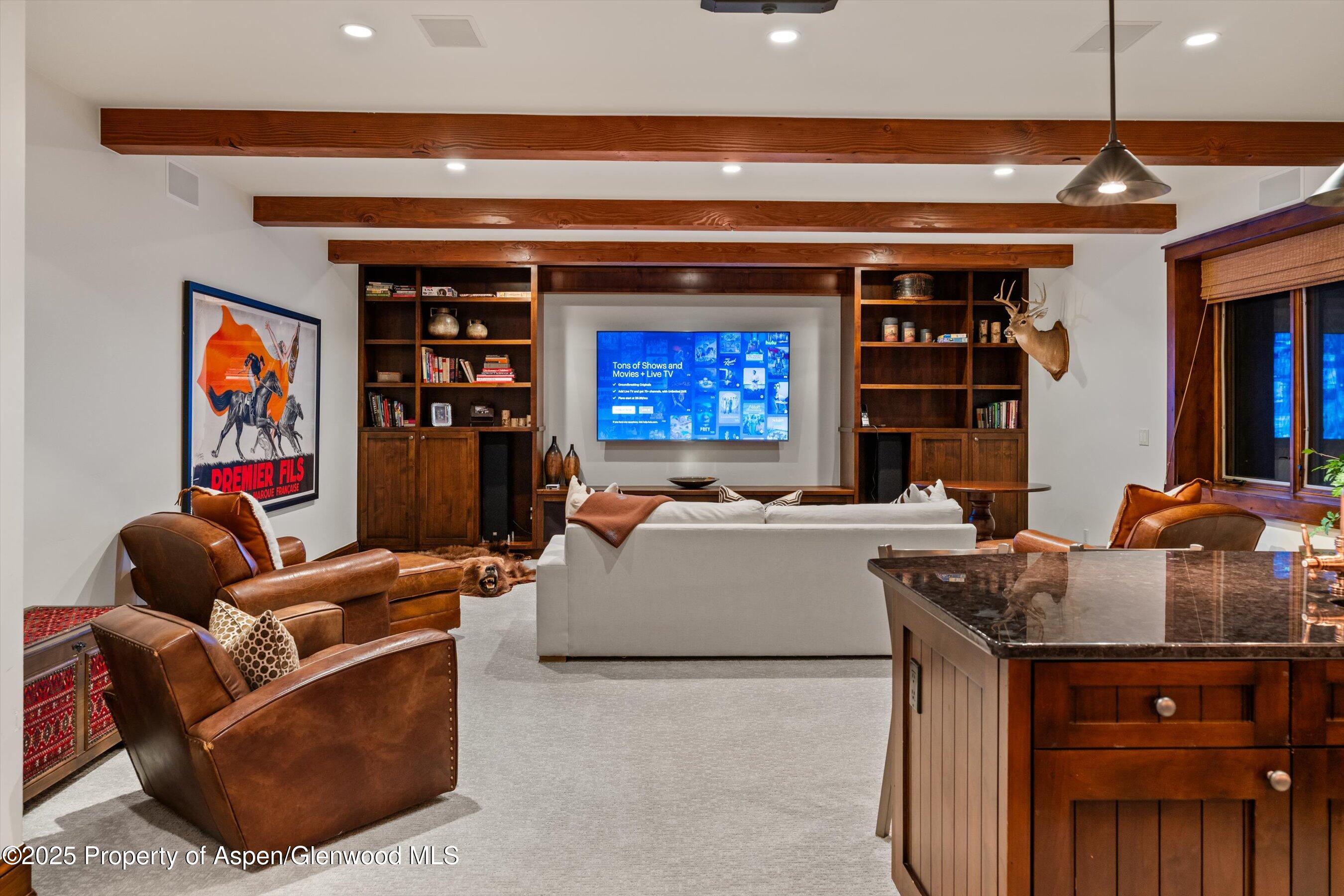 1430 Sierra Vista Drive Aspen, CO 81611 - Photo 35 of 57 a living room with furniture and a fireplace