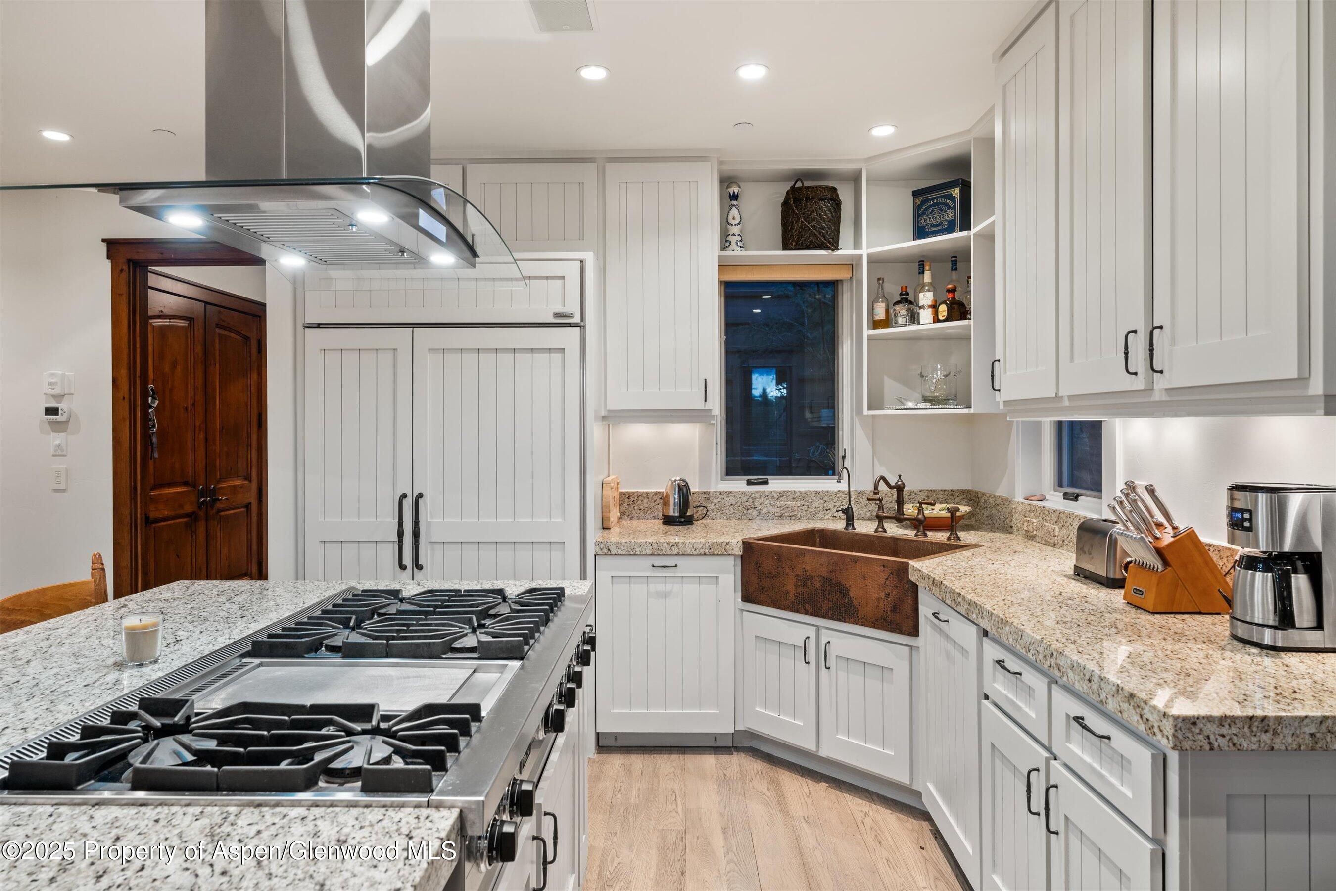1430 Sierra Vista Drive Aspen, CO 81611 - Photo 4 of 57 a kitchen with stainless steel appliances granite countertop a stove and a sink