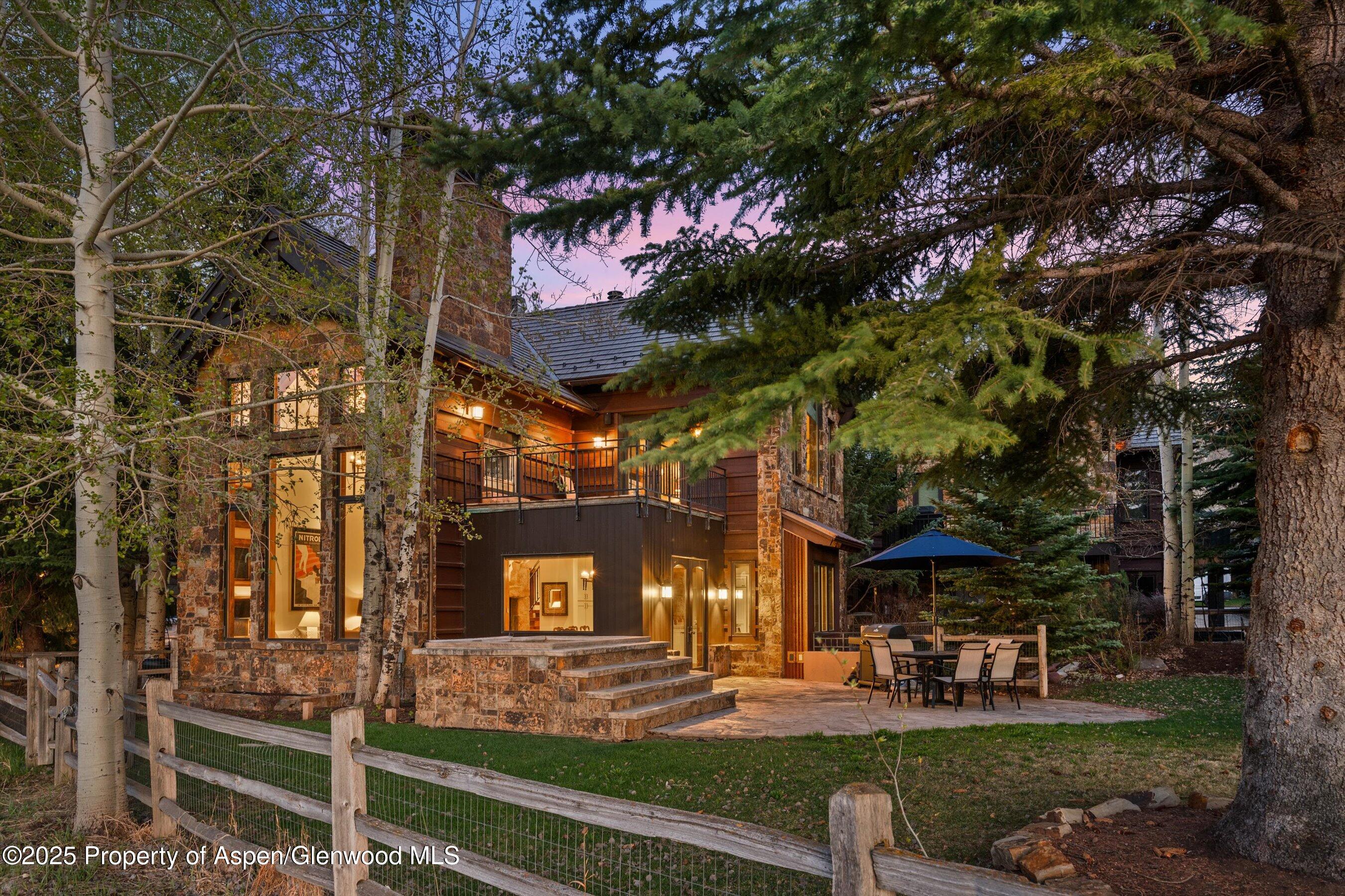 1430 Sierra Vista Drive Aspen, CO 81611 - Photo 43 of 57 a front view of a house with a yard