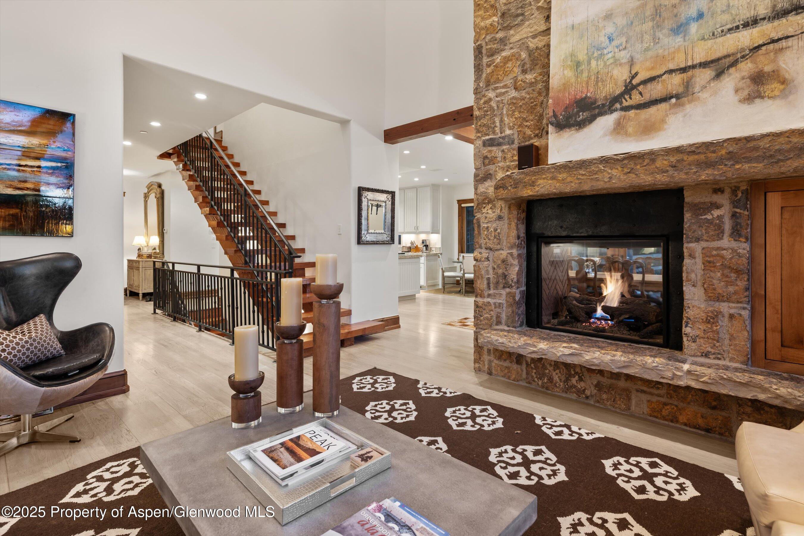 1430 Sierra Vista Drive Aspen, CO 81611 - Photo 8 of 57 a living room with furniture and a fireplace