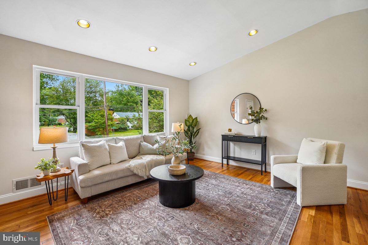 827 Caddington Avenue Silver Spring, MD 20901 - Photo 6 of 45 a living room with furniture and a potted plant