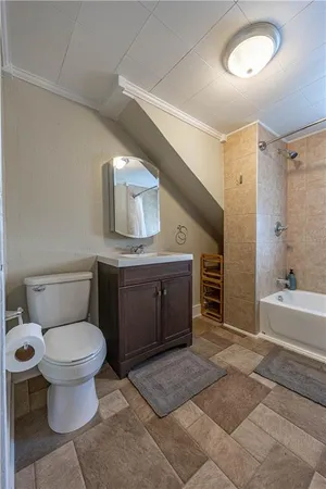 a spacious bathroom with a granite countertop toilet and a sink