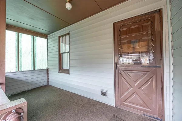 a view of front door and bedroom