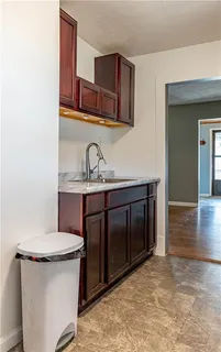 a bathroom with a sink a toilet and mirror