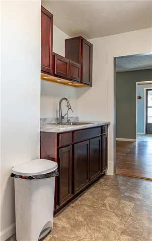 a bathroom with a sink a toilet and mirror