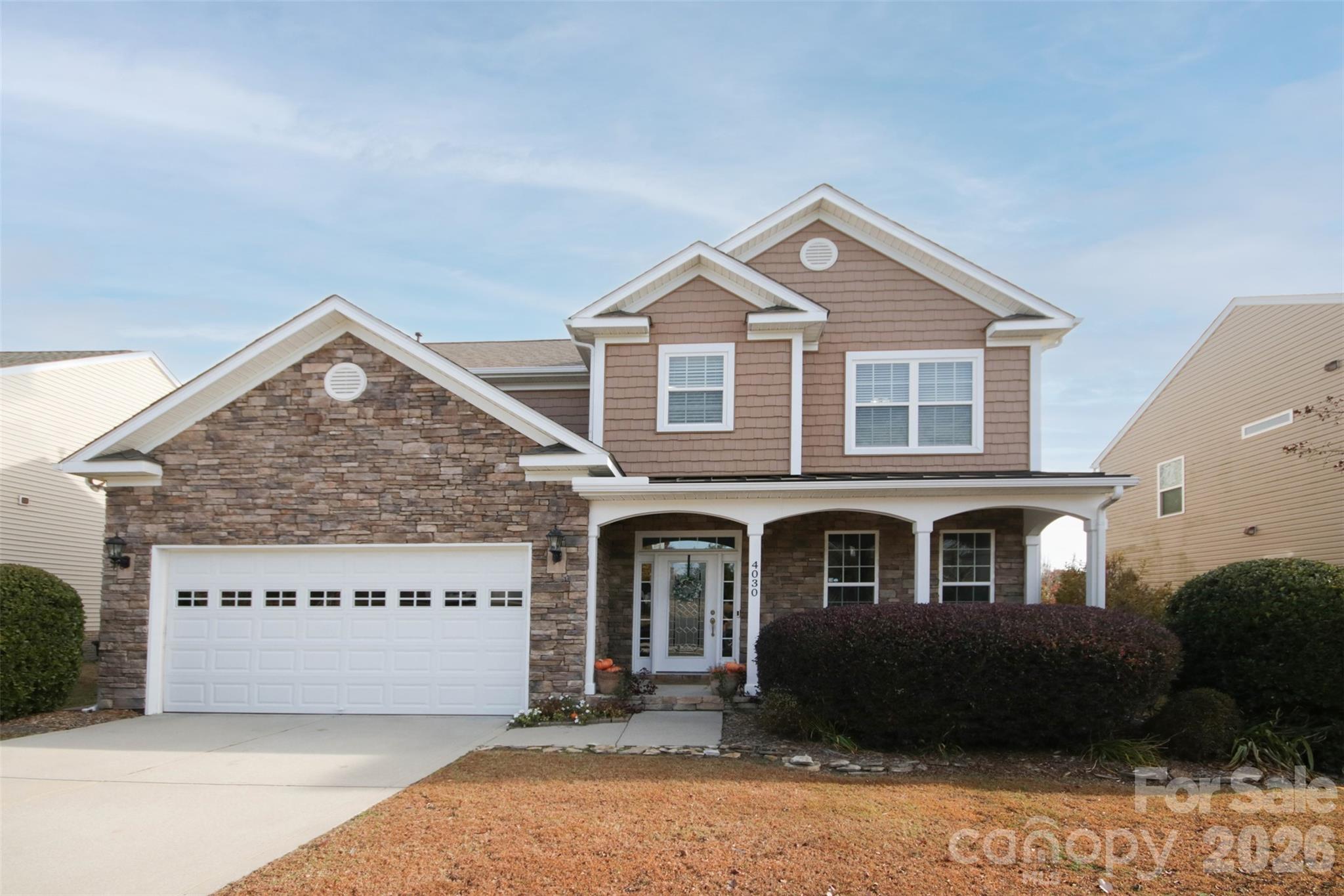 4030 Sunset Ridge Drive Rock Hill, SC 29732 - Photo 2 of 39 a front view of a house with a yard and garage