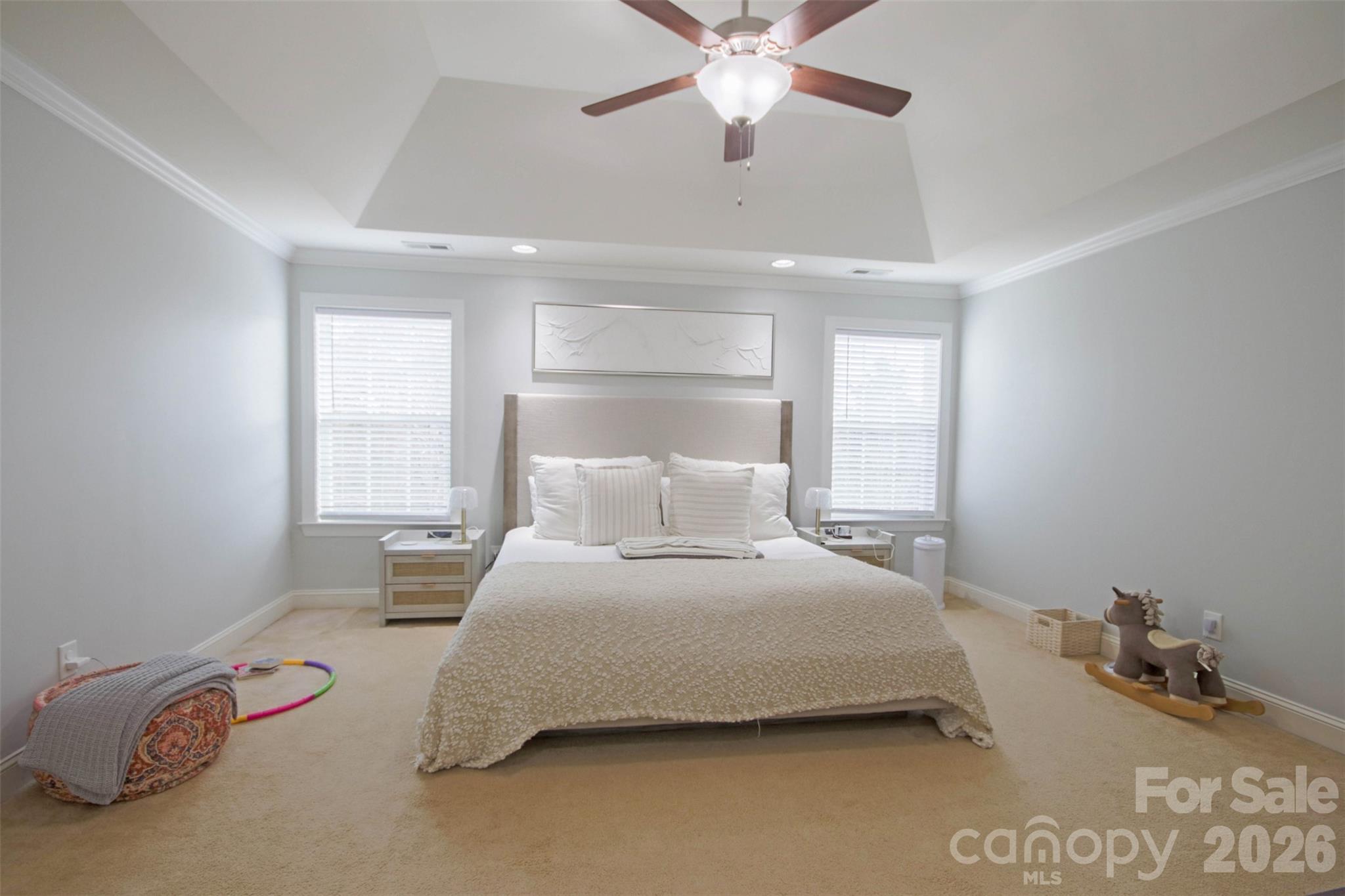 4030 Sunset Ridge Drive Rock Hill, SC 29732 - Photo 26 of 39 a bedroom with a bed and a chandelier
