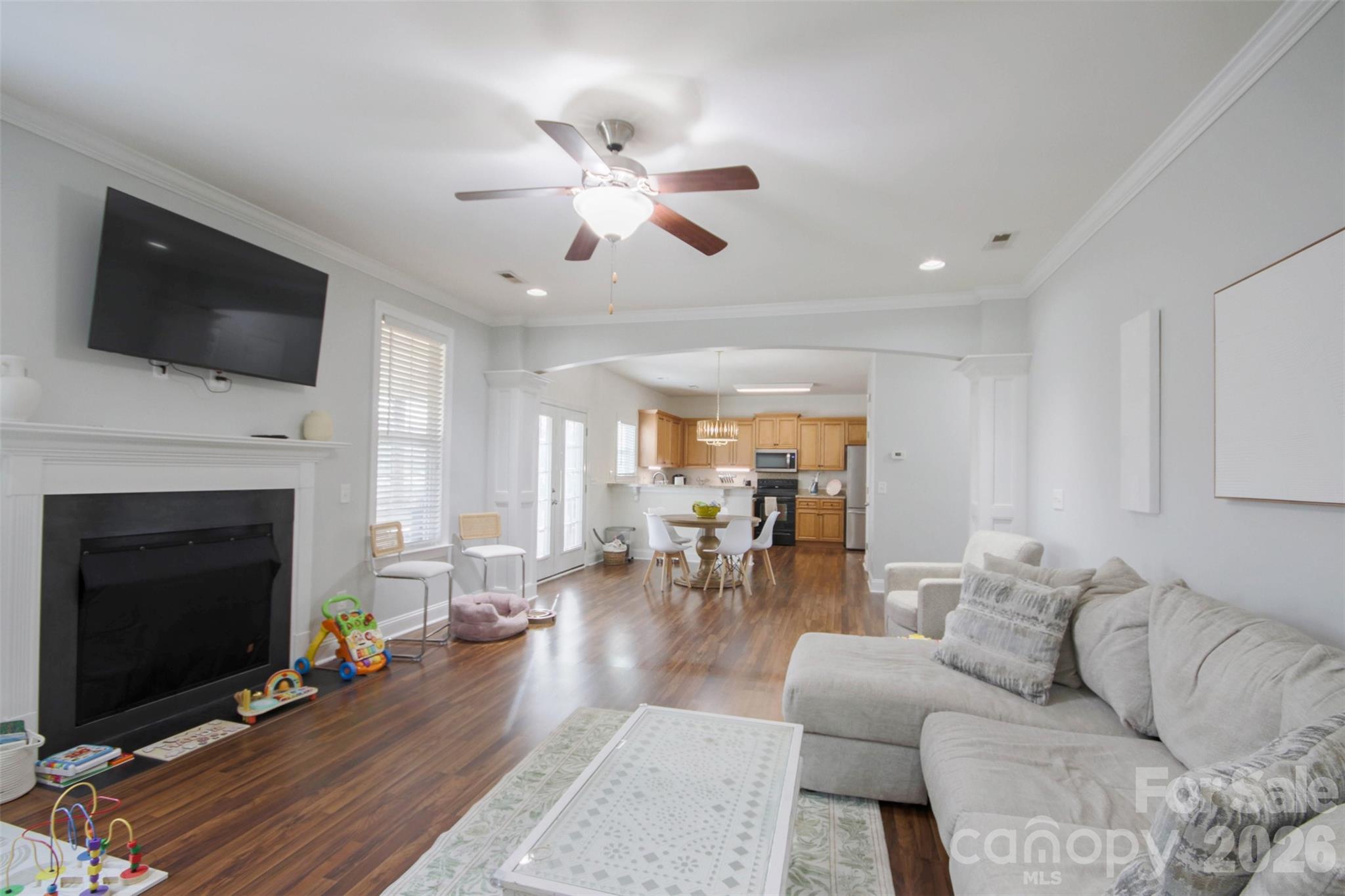 4030 Sunset Ridge Drive Rock Hill, SC 29732 - Photo 8 of 39 a living room with furniture a fireplace and a flat screen tv