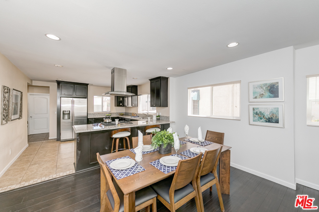 2816 Virginia Road Los Angeles, CA 90016 - Photo 1 of 29 a view of a dining room with furniture a kitchen and chandelier