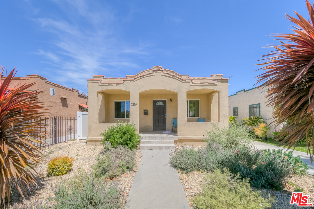 2816 Virginia Road Los Angeles, CA 90016 - Photo 2 of 29 a front view of a house with garden