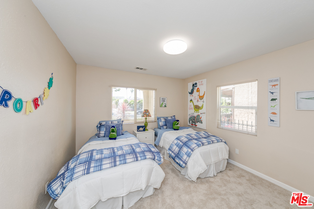2816 Virginia Road Los Angeles, CA 90016 - Photo 15 of 29 a bedroom with two beds and a window