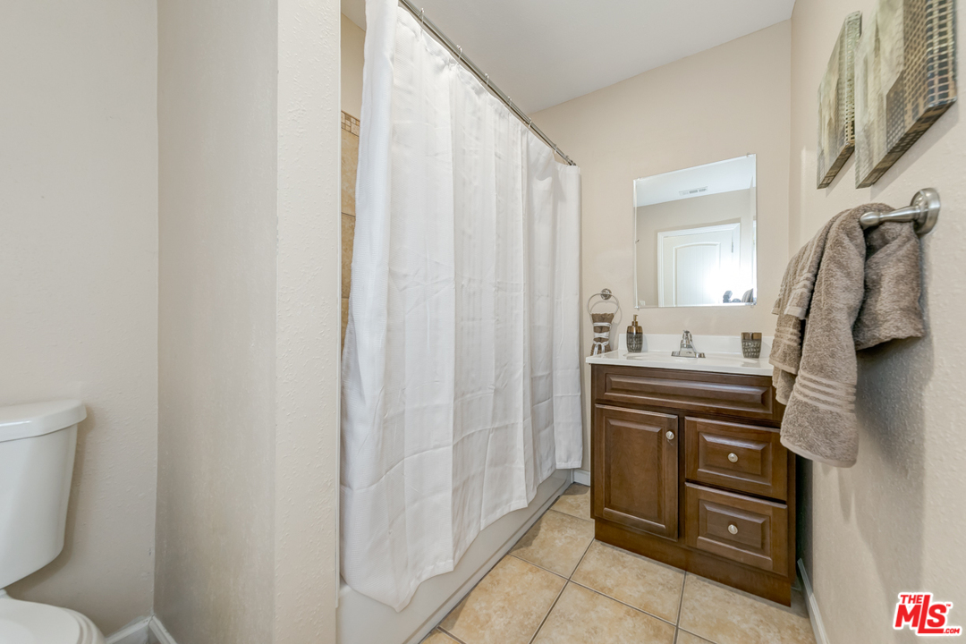 2816 Virginia Road Los Angeles, CA 90016 - Photo 17 of 29 a bathroom with a sink a toilet and shower