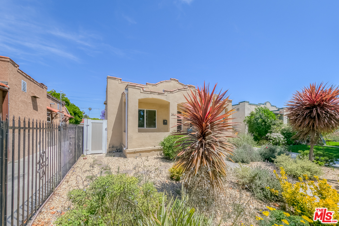 2816 Virginia Road Los Angeles, CA 90016 - Photo 3 of 29 a view of a house with a small yard and a yard