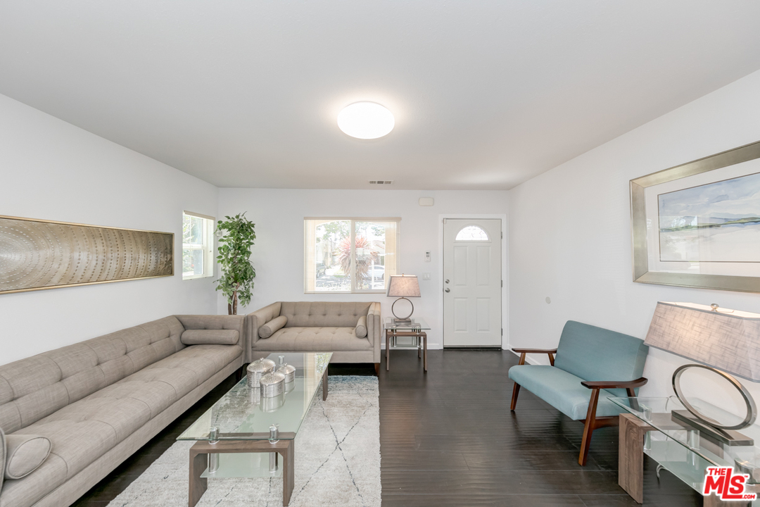 2816 Virginia Road Los Angeles, CA 90016 - Photo 7 of 29 a living room with furniture and a large window