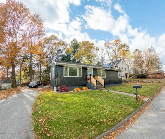 a view of a house with a back yard