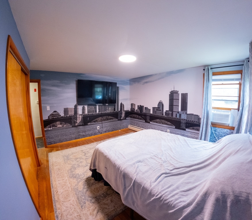 25 A White Avenue Worcester, MA 01605 - Photo 13 of 13 a bed room with a bed and a television