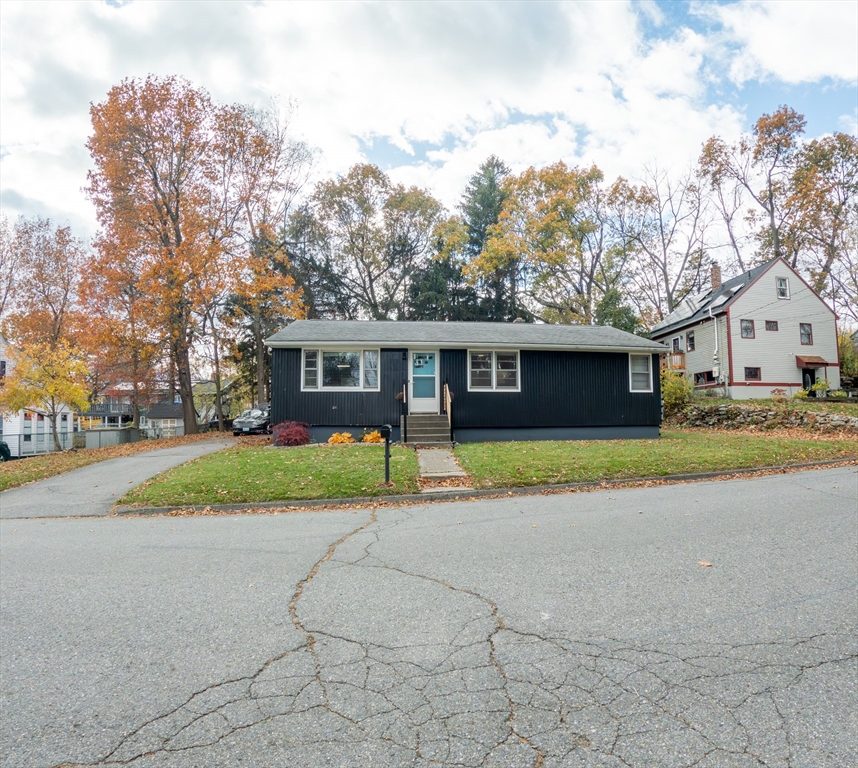 25 A White Avenue Worcester, MA 01605 - Photo 2 of 13 a house with trees in the background