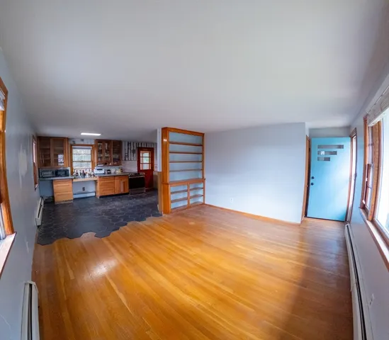 a view of a livingroom with furniture and a wooden floor