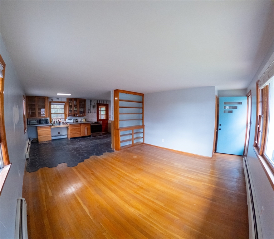 25 A White Avenue Worcester, MA 01605 - Photo 7 of 13 a view of a livingroom with furniture and a wooden floor