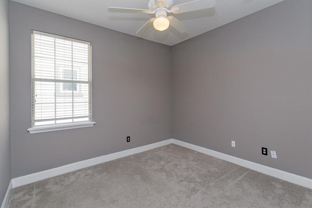 41 East Spruce Street Orlando, FL 32804 - Photo 19 of 24 an empty room with a window and a fan