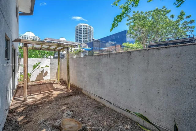 a view of outdoor space and backyard