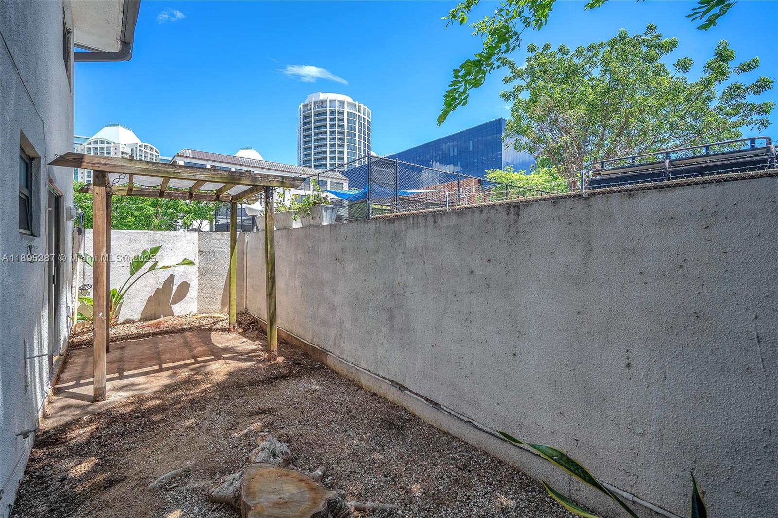 3265 Virginia Street, Unit 8 Miami, FL 33133 - Photo 15 of 24 a view of outdoor space and backyard