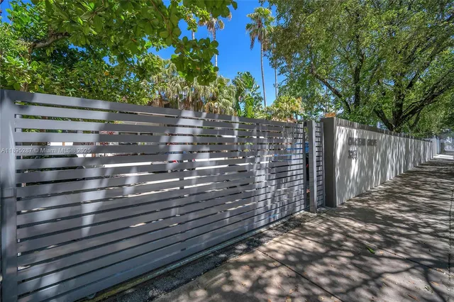 a view of outdoor space with wooden fence