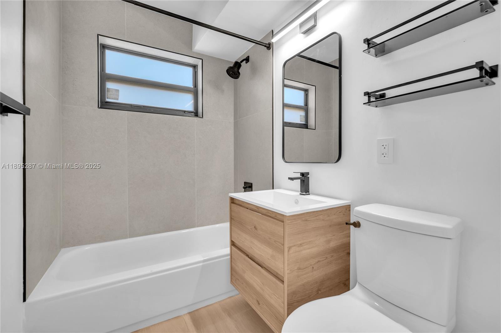 3265 Virginia Street, Unit 8 Miami, FL 33133 - Photo 9 of 24 a bathroom with a toilet sink and bathtub